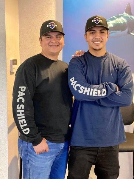 Photo of Rafael and Michael in PAC Shield attire